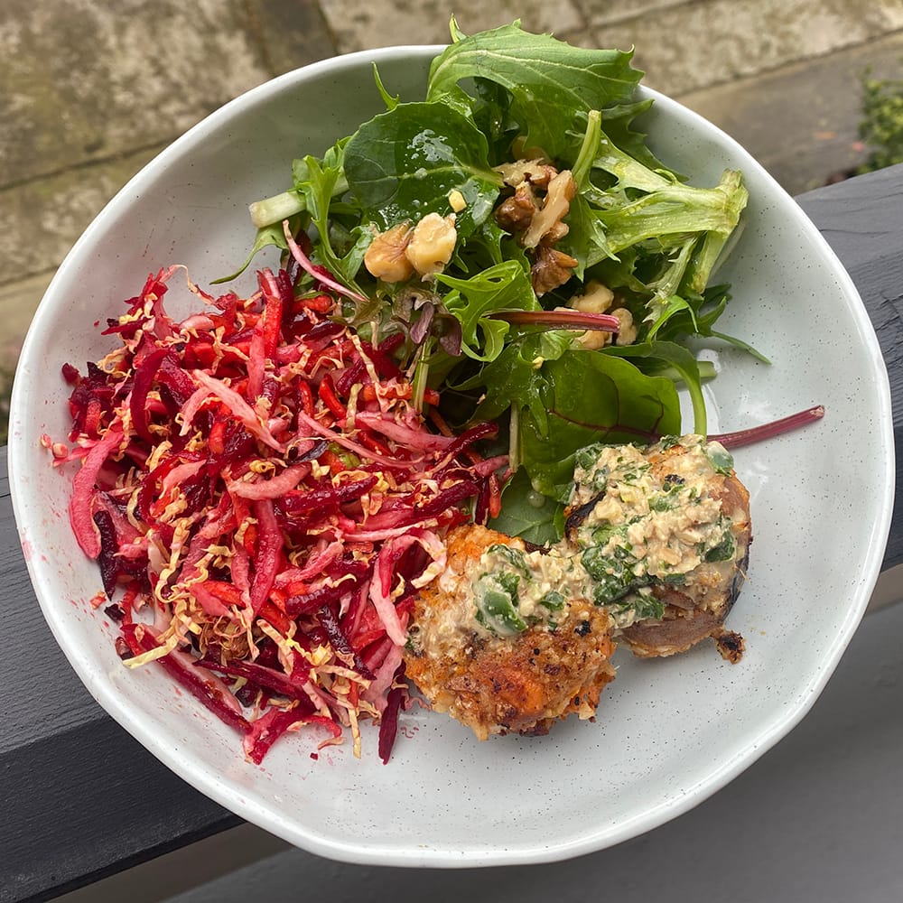 tasty wombok and beetroot slaw with sweet potato and cauliflower bites and leaf salad with mustard and lime dressing