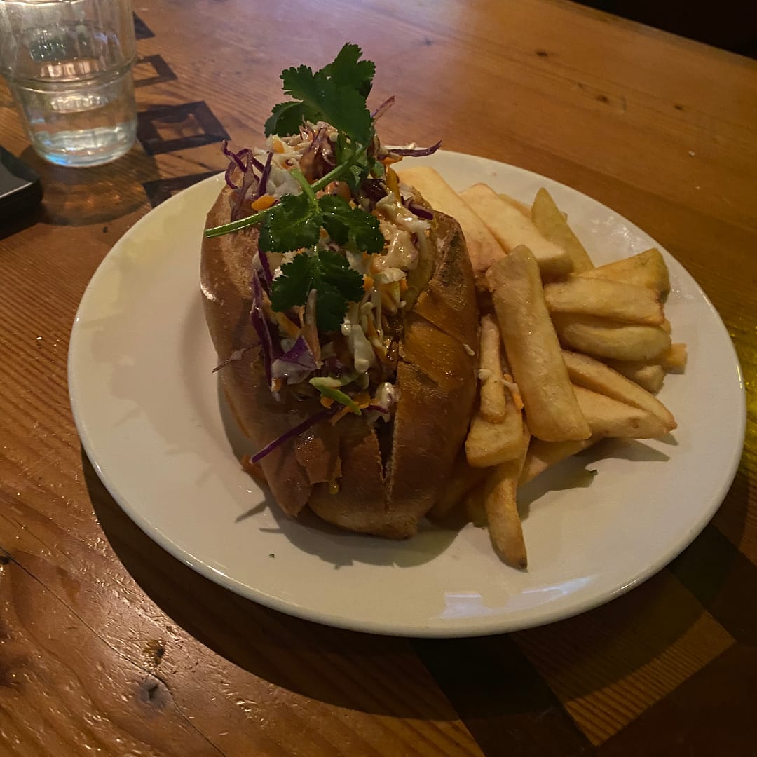 chipotle pulled tempeh roll with chips - the fox hotel