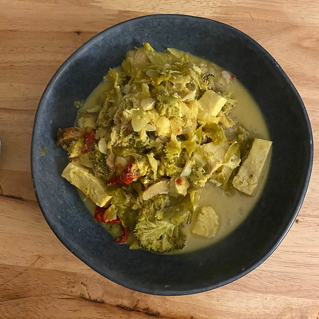 coconut fish curry with lemongrass, broccoli, snow peas, chilli and turmeric