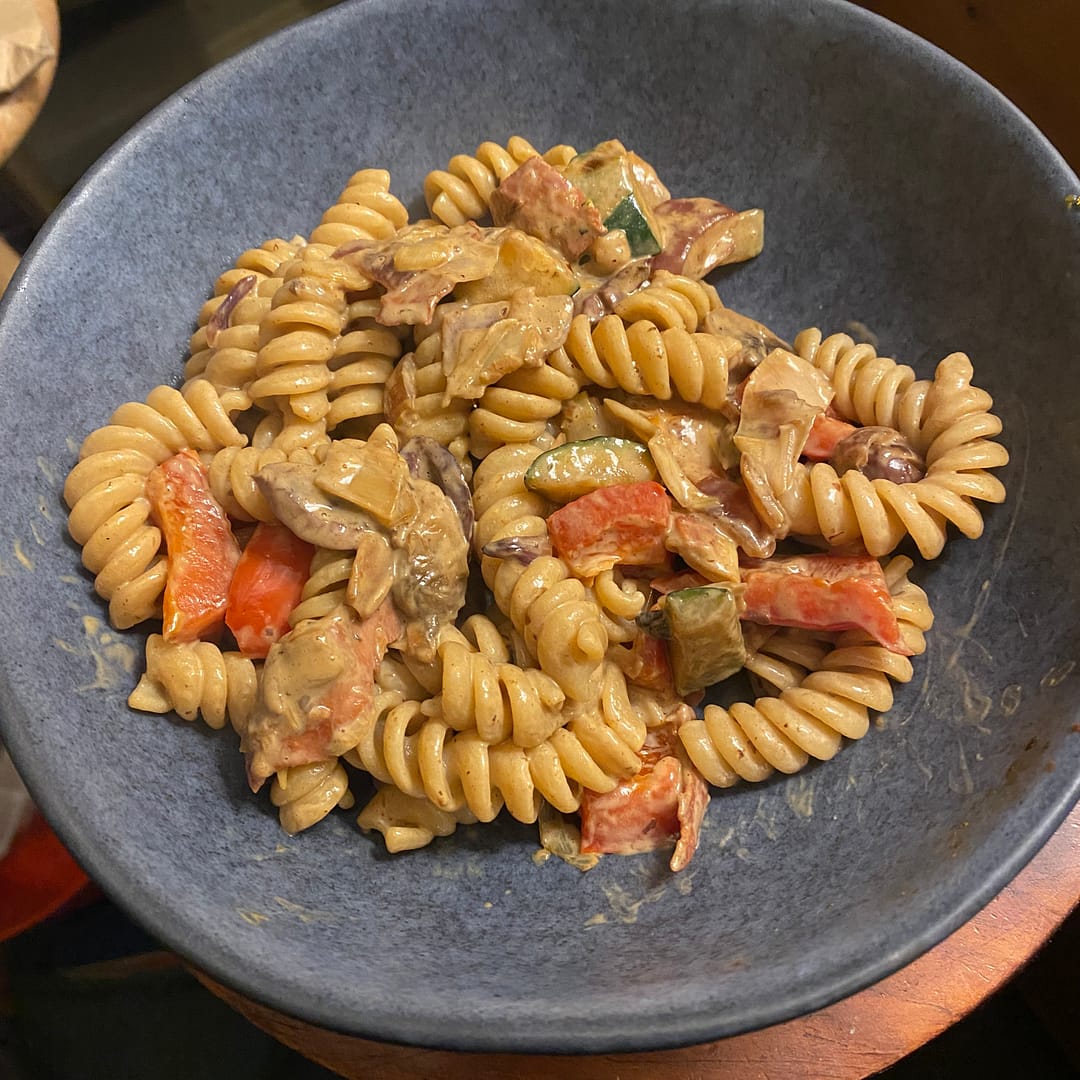 creamy Mediterranean pasta dish with chilli and chopped salami