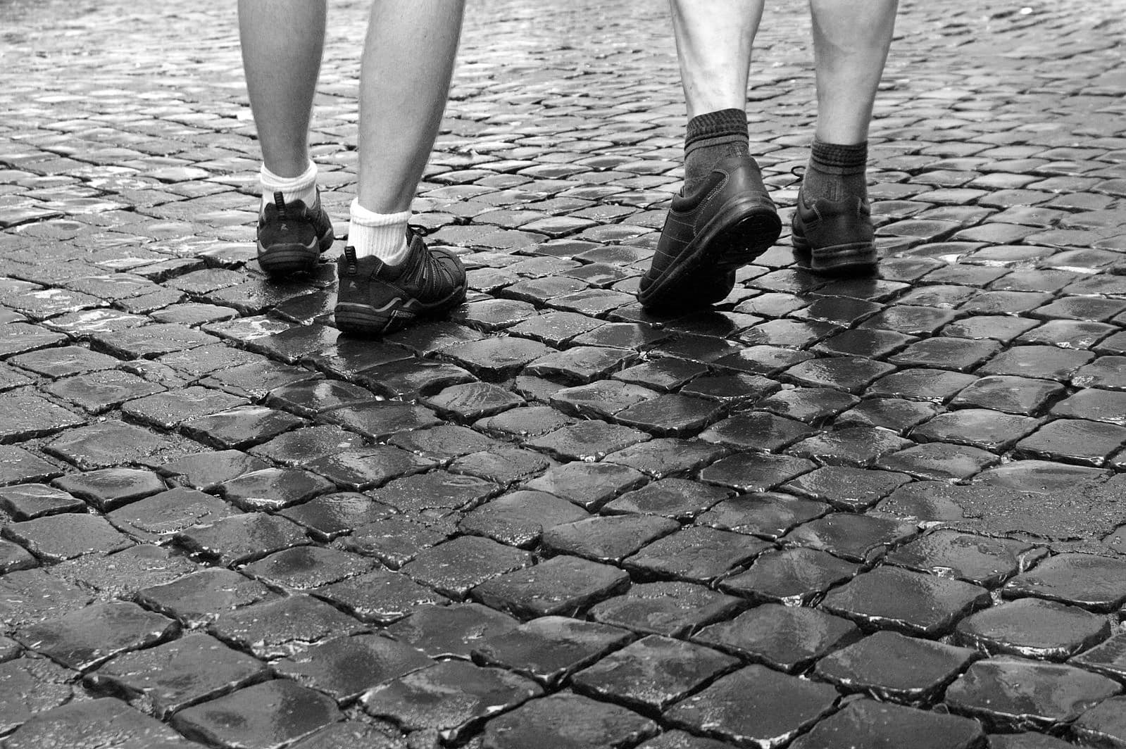 walking 10,000 steps per day for activity requirements - walking on cobblestones in Rome